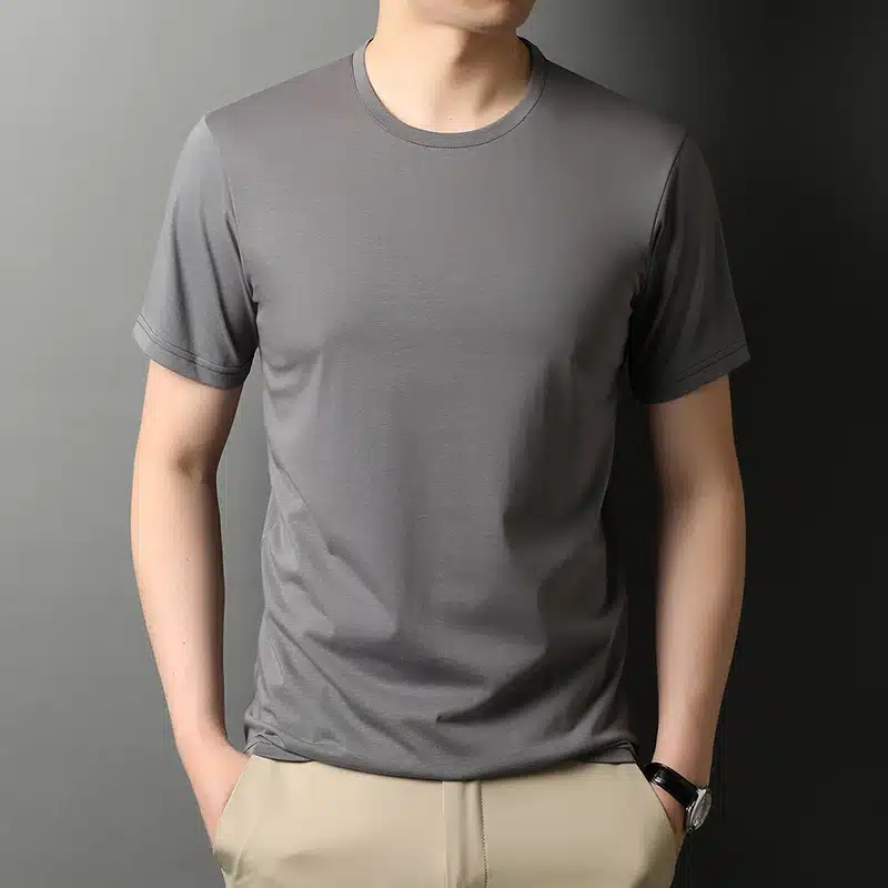 A man wearing a gray t - shirt